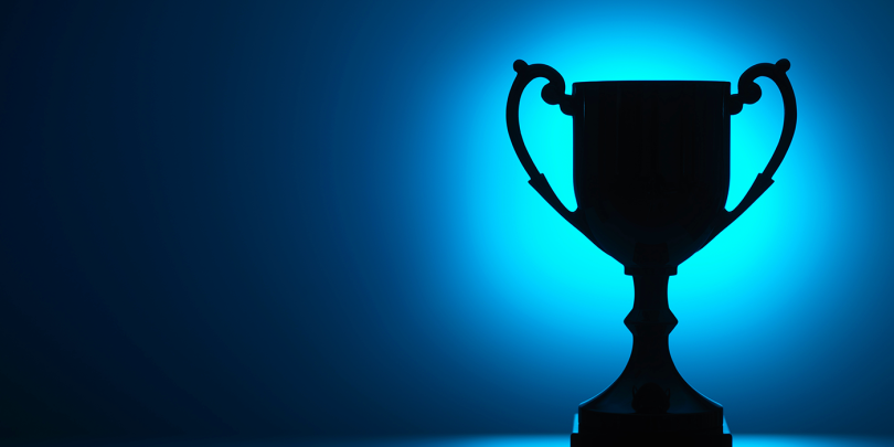 trophy-silhouette-blue-background
