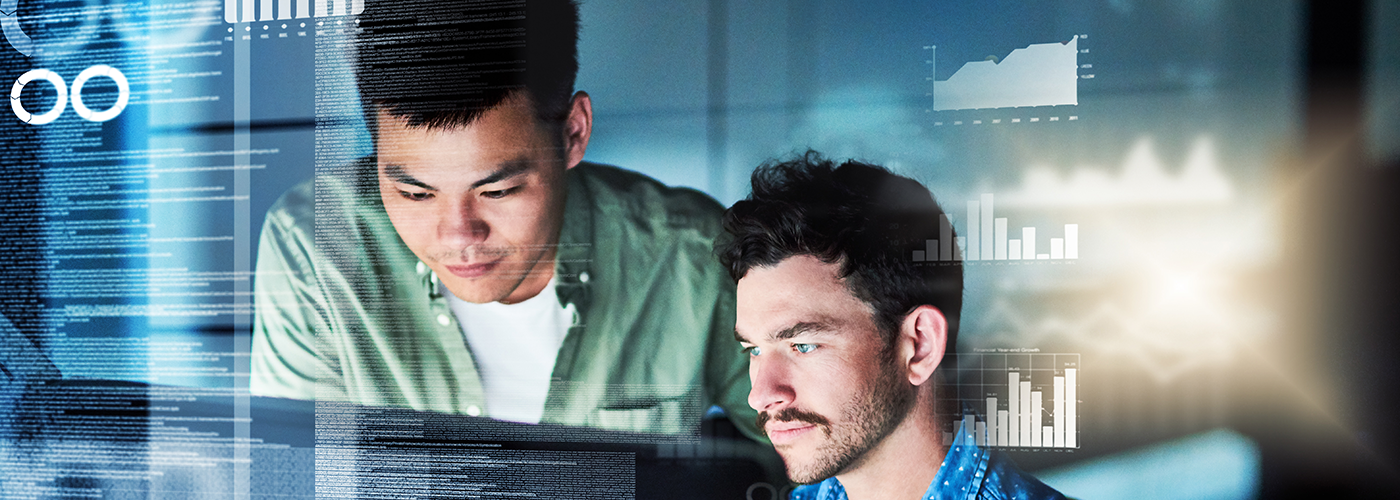 2-men-looking-at-screen-with-analytics-1400x700