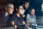 4-people-looking-at-binary-code screen-1400x700